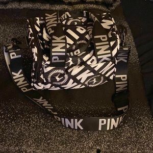Pink, black and white handbag with the scrap never worn in great condition
